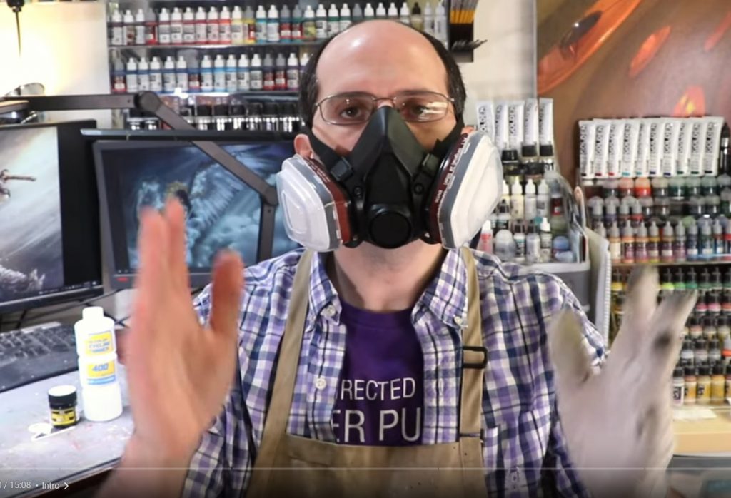 A screenshot from Vince Venturella's stream greeting his audience as he is wearing a large paint mask. He was wearing this because enamel paints are toxic, especially when sprayed.